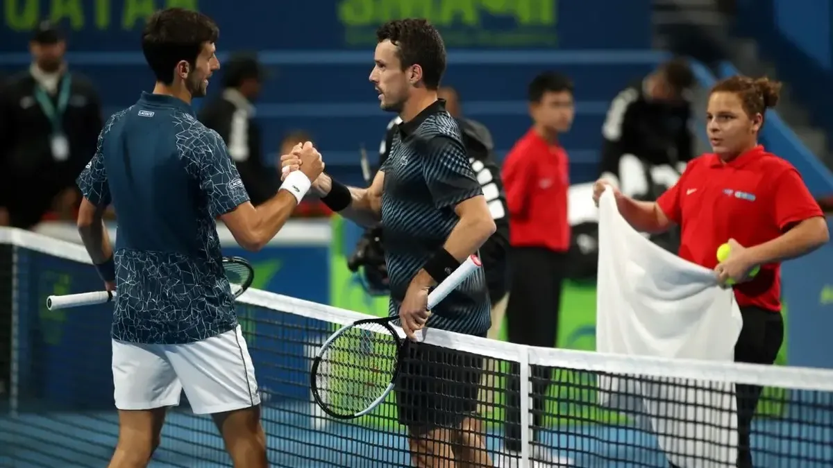 Roberto Bautista y Novak Djokovic.