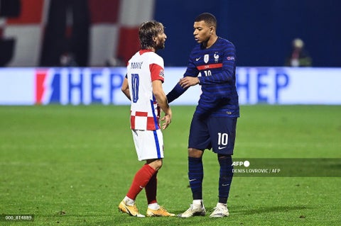 Luka Modric y Kylian Mbappé