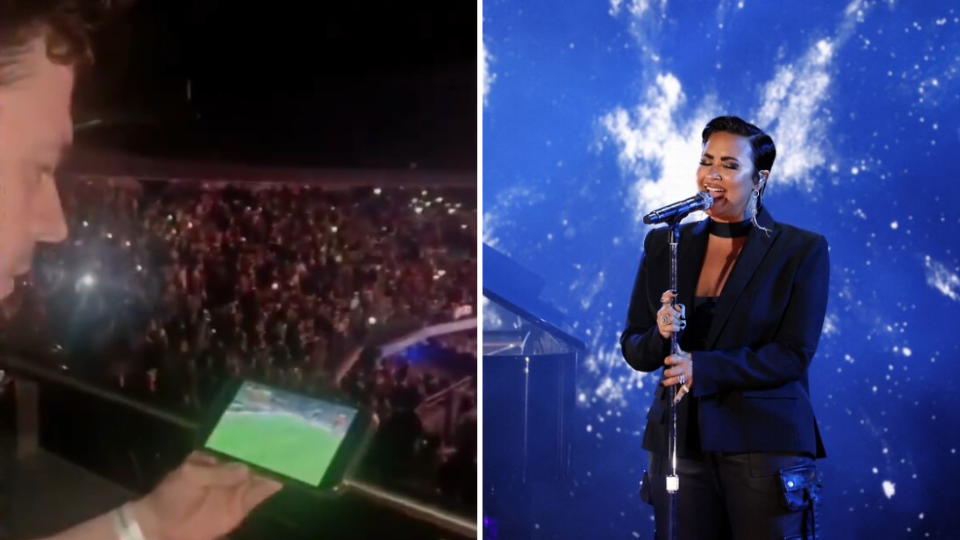 Aficionado de Millonarios FC viendo el partido de la semifinal de la copa Betplay ante el Medellín en pleno concierto de la artista Demi Lovato