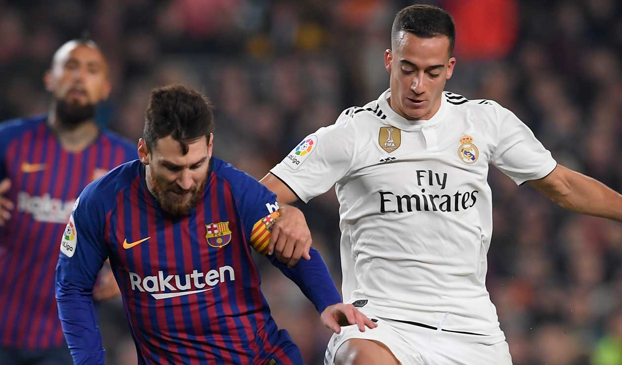 Messi ante la presión de Lucas Vázquez